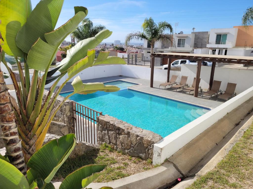 a swimming pool on the roof of a house at Relaxing Place Near the Sea in Ensenada