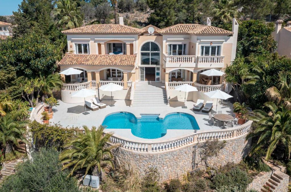 an aerial view of a house with a swimming pool at Holiday Villa Port d'Andratx in Port d'Andratx