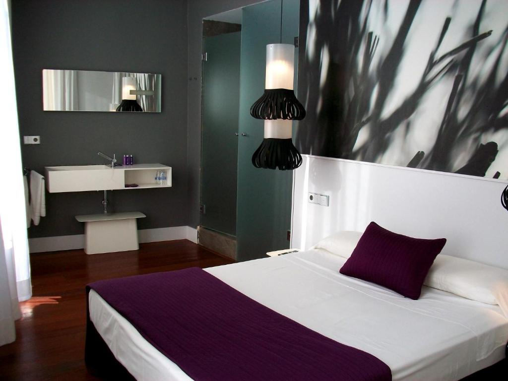 Postel nebo postele na pokoji v ubytování Khu Hotel