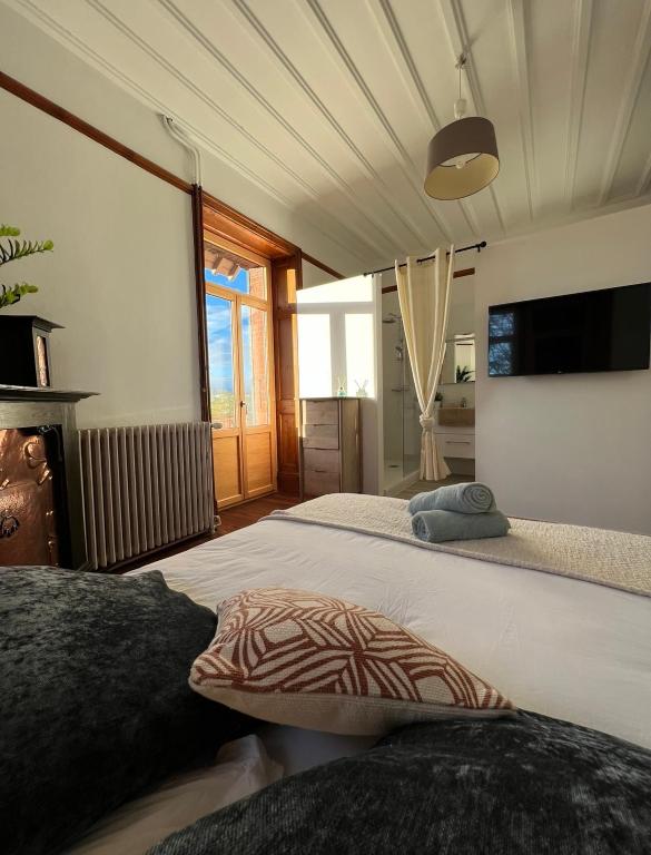 Posteľ alebo postele v izbe v ubytovaní O'Cottage suite Familiale