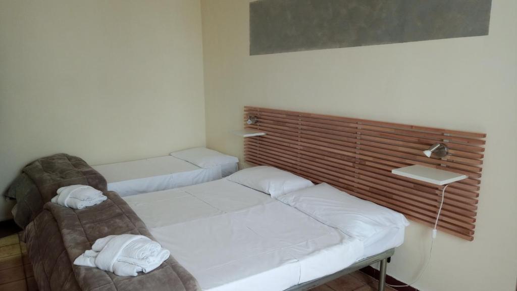 Postel nebo postele na pokoji v ubytování Hotel Eliseo Napoli