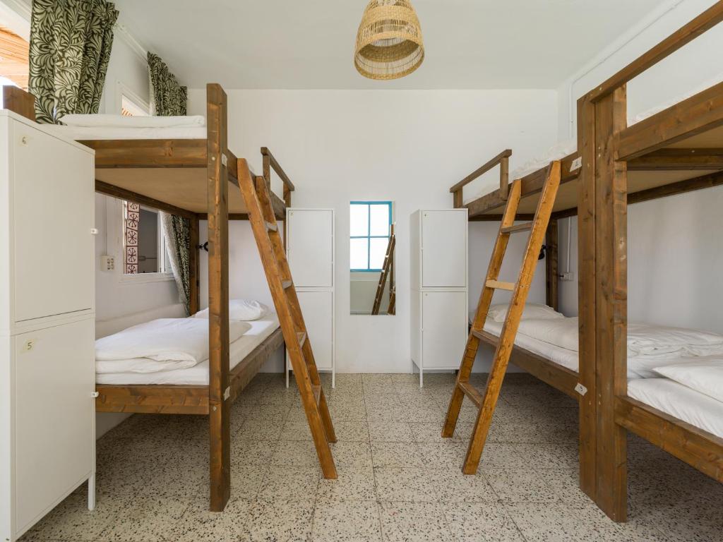 Posteľ alebo postele v izbe v ubytovaní Jungle House