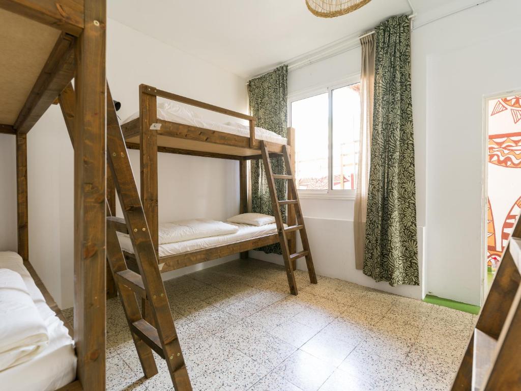 Posteľ alebo postele v izbe v ubytovaní Jungle House