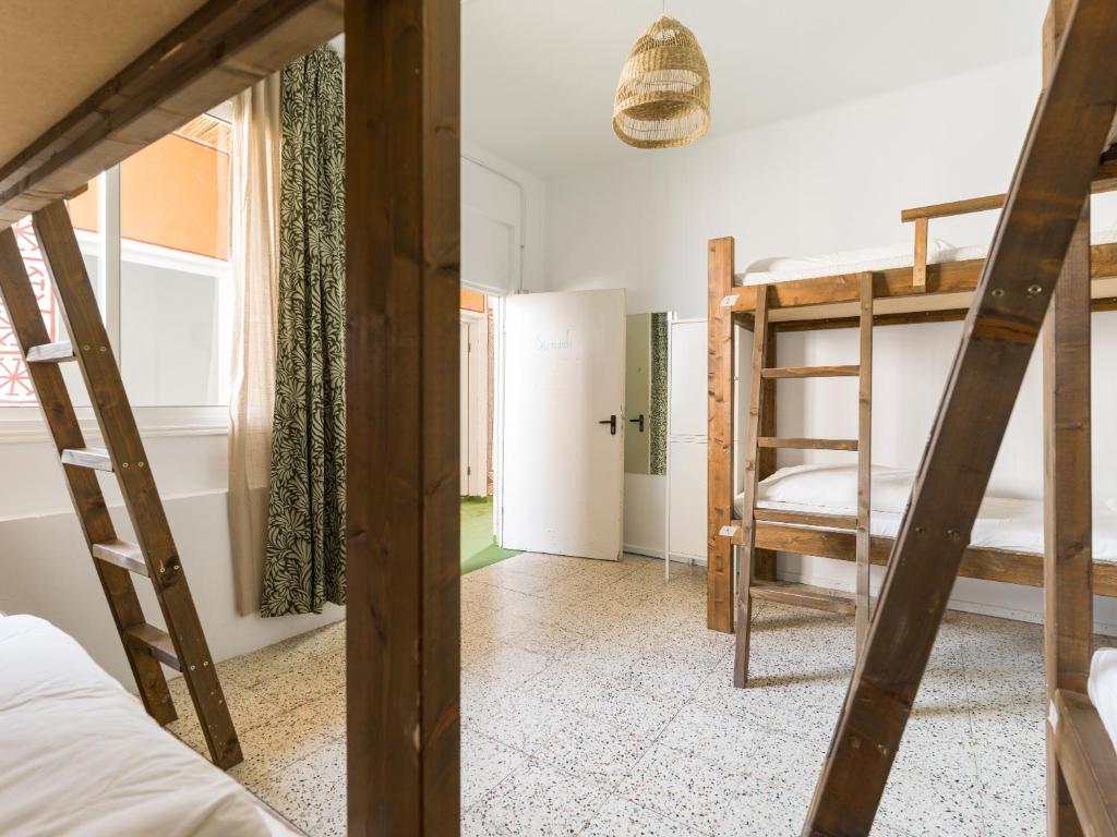 Posteľ alebo postele v izbe v ubytovaní Jungle House