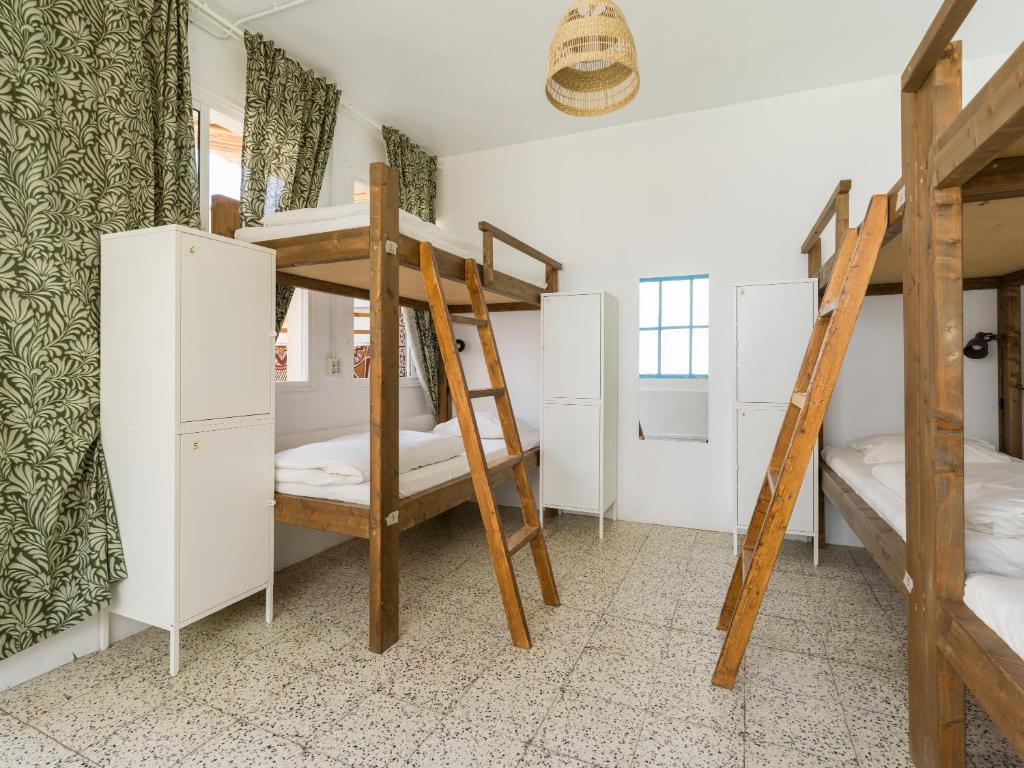 Posteľ alebo postele v izbe v ubytovaní Jungle House