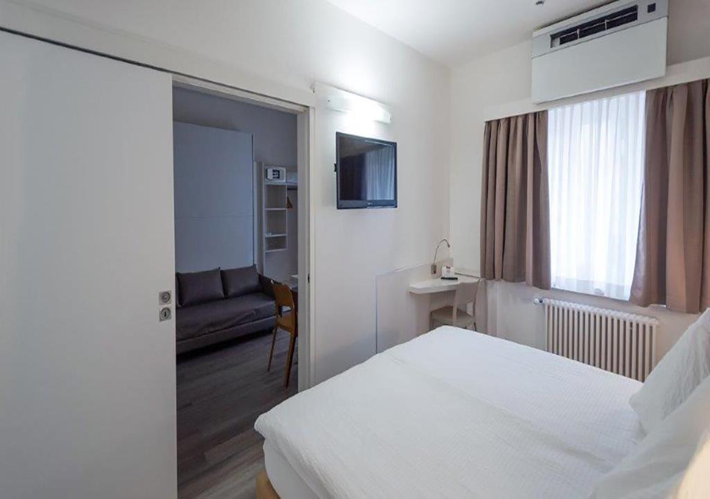 Letto o letti in una camera di Acquarello Swiss Quality Hotel