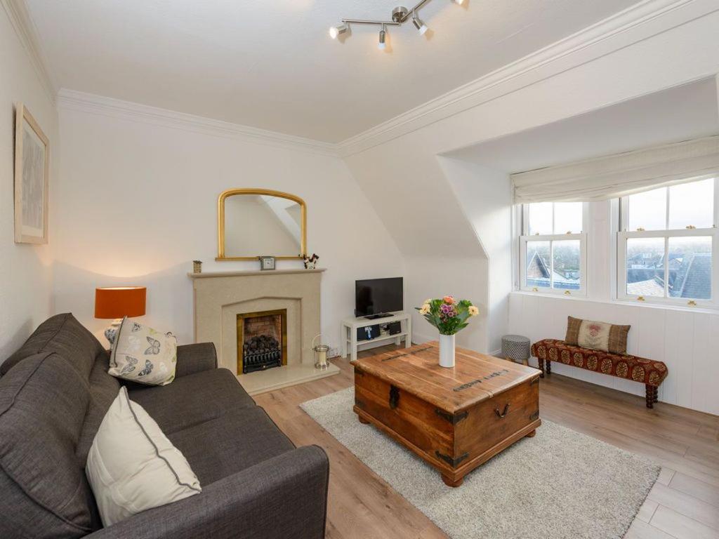 a living room with a couch and a coffee table at Goose Green View in Gullane