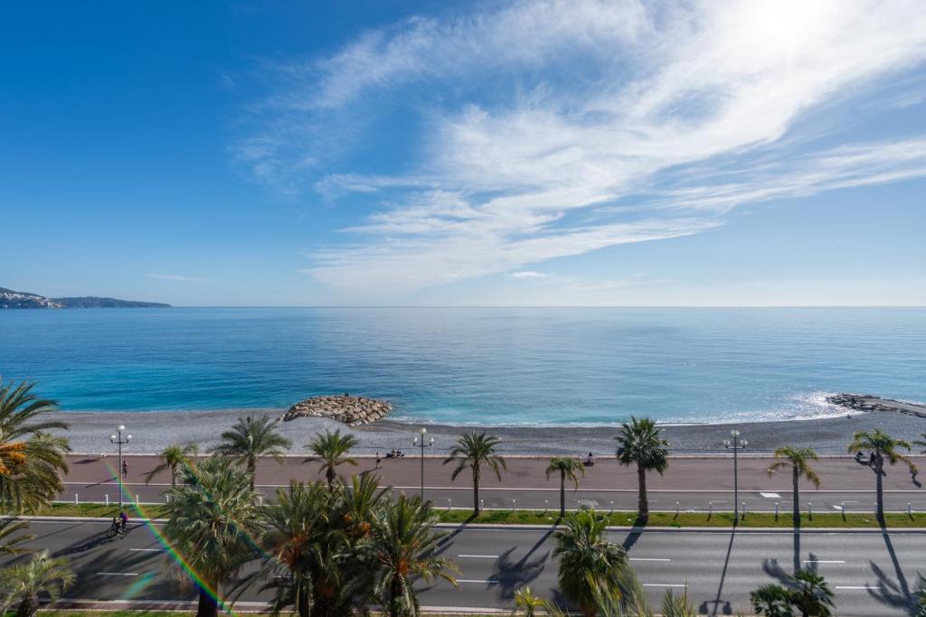 a view of the ocean from the balcony of a resort at SEA FRONT - panoramic sea view studio with terrace in Nice