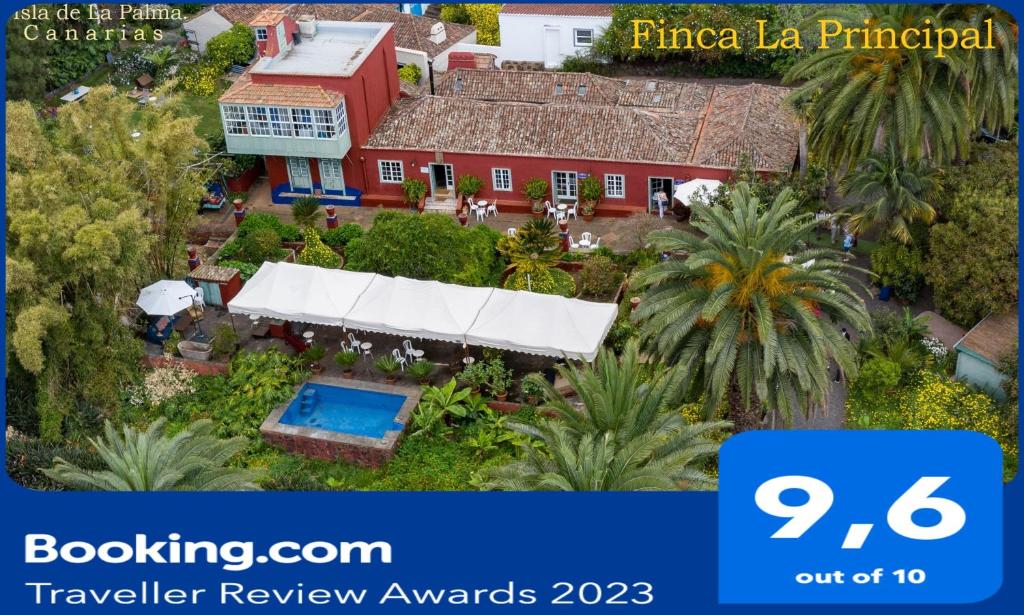 an aerial view of a red house with a pool at Finca La Principal in Breña Alta