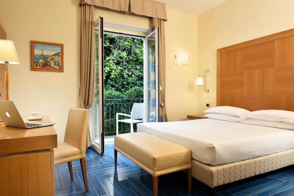 Posteľ alebo postele v izbe v ubytovaní Hotel Raito Wellness & SPA