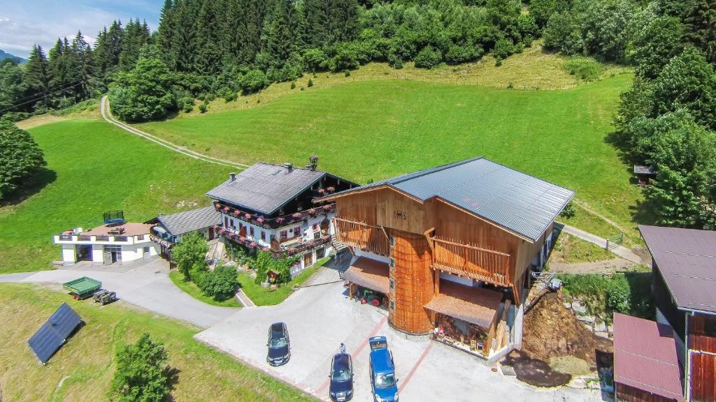 an aerial view of a large house on a hill at Ferienwohnung Remberghof in Viehhofen