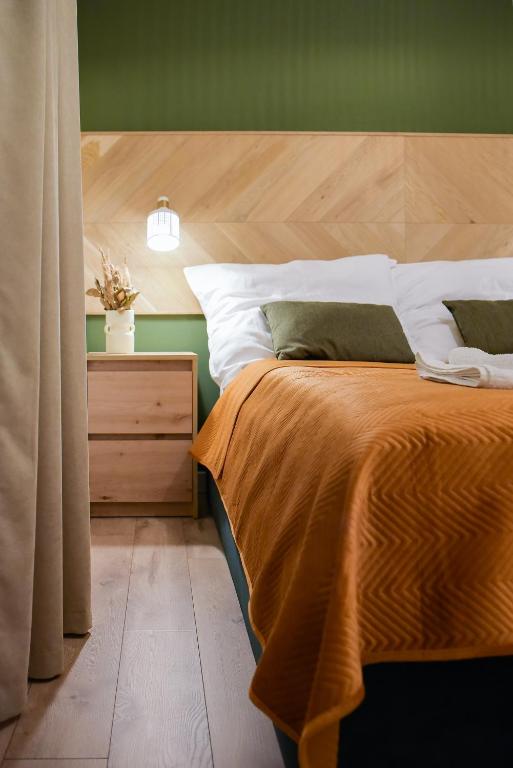Postel nebo postele na pokoji v ubytování Greenside SunPark Apartament