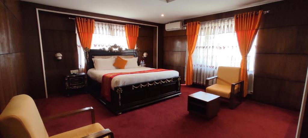 Voodi või voodid majutusasutuse Hotel Ananda Pashupati toas