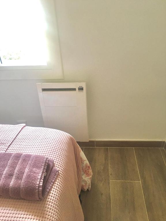 Postel nebo postele na pokoji v ubytování Apartmento RIPOLLES cerca de la Playa