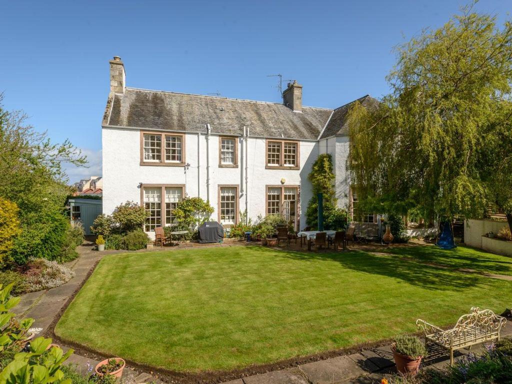 a large white house with a large yard at Nungate in North Berwick