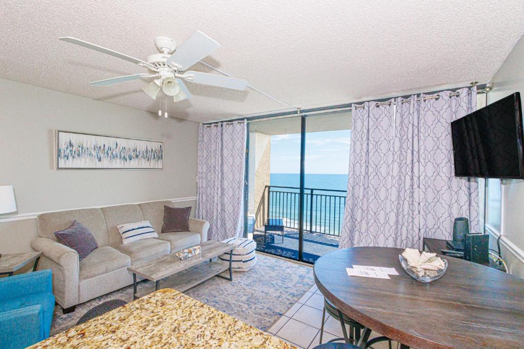 a living room with a couch and a table at Oceanfront 1 bedroom King suite- Ocean Forest Plaza 1911 in Myrtle Beach
