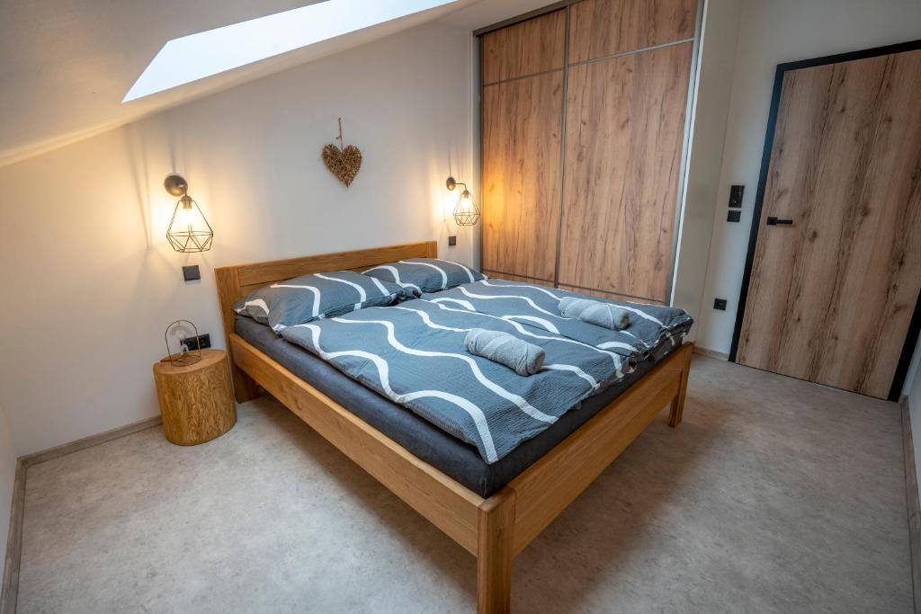 Postel nebo postele na pokoji v ubytování Lázeňské Apartmány