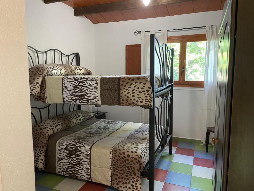 Posteľ alebo postele v izbe v ubytovaní Allotjament rural Illa de Mar