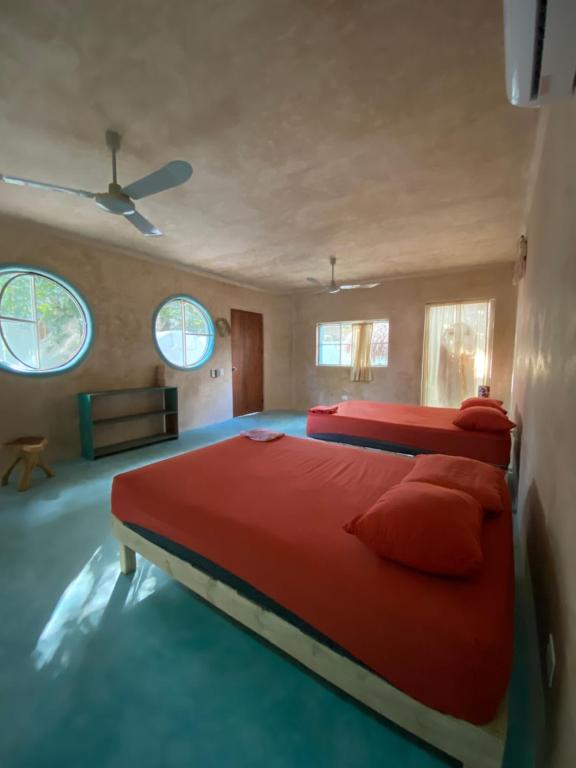 Postel nebo postele na pokoji v ubytování Tubo Tulum Hostel