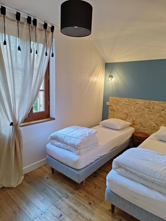 Posteľ alebo postele v izbe v ubytovaní Maison de vacances à la campagne