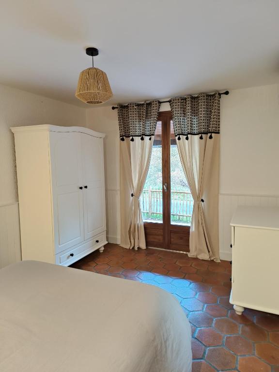 Posteľ alebo postele v izbe v ubytovaní Maison de vacances à la campagne