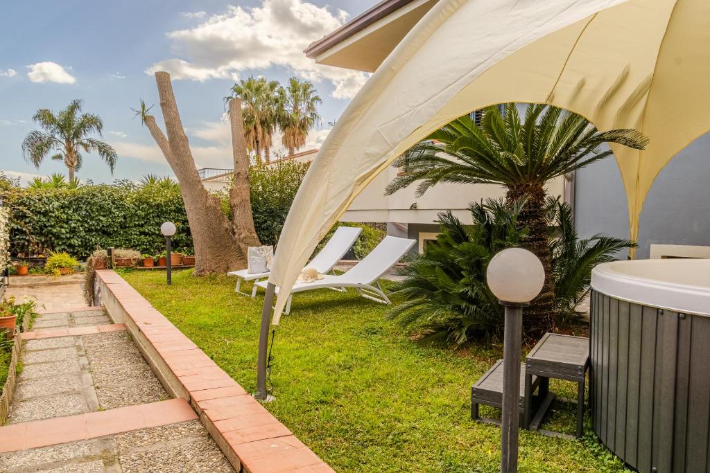 a tent in the backyard of a house at Villa TreA in Mascali