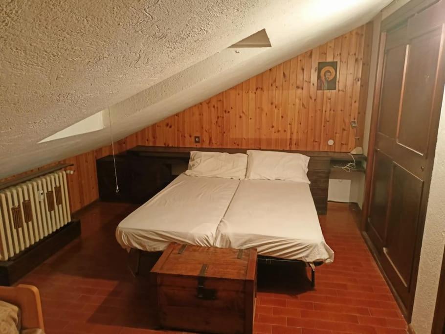 Postel nebo postele na pokoji v ubytování Mansarda