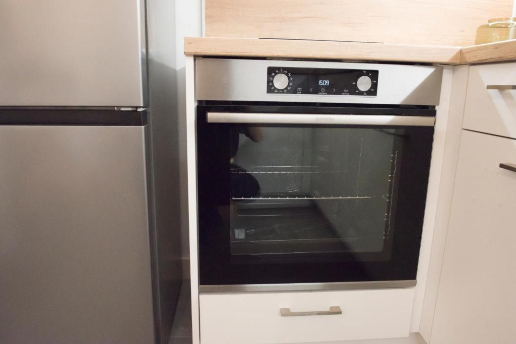 A kitchen or kitchenette at Top Center Designer Studio Apartment