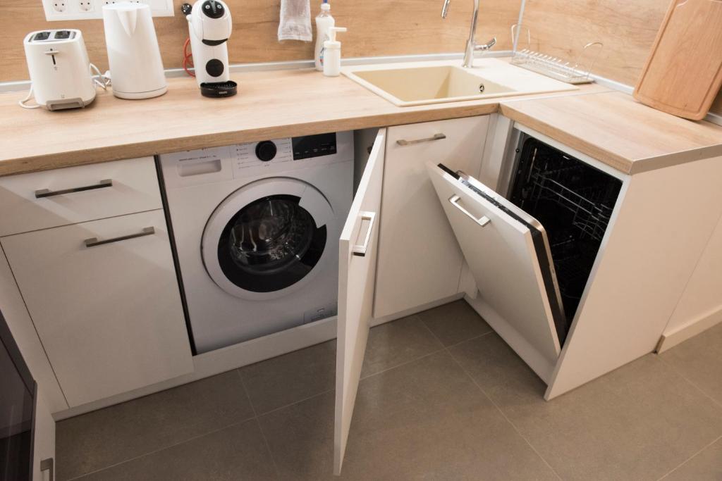 A kitchen or kitchenette at Top Center Designer Studio Apartment