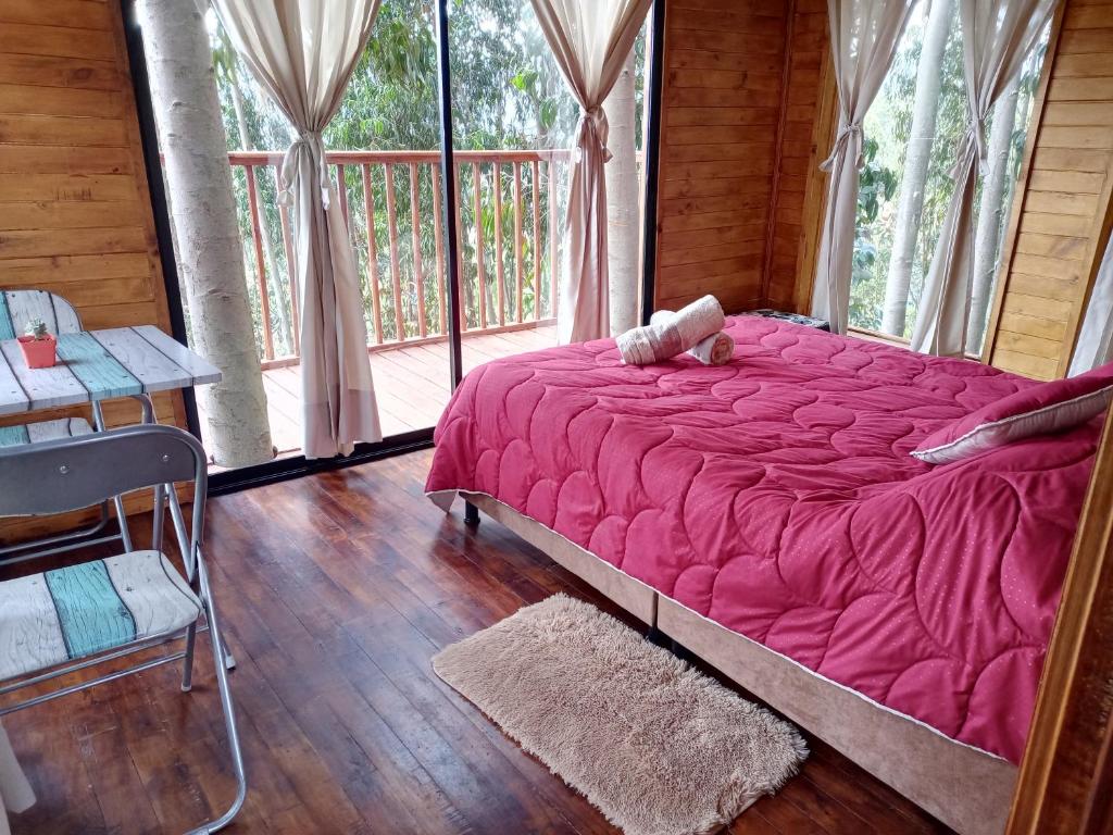 Postel nebo postele na pokoji v ubytování Casa en el Árbol Guatavita
