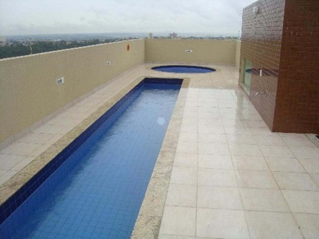 a swimming pool on the roof of a building at Flats Sierra Bela Vista in Goiânia