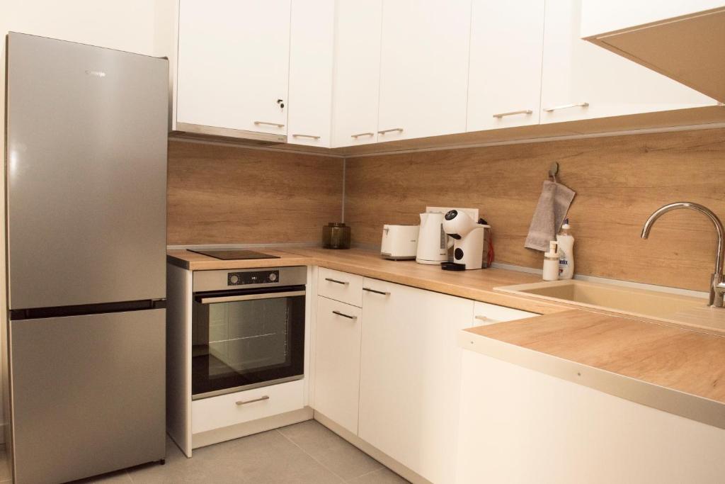 A kitchen or kitchenette at Top Center Designer Studio Apartment