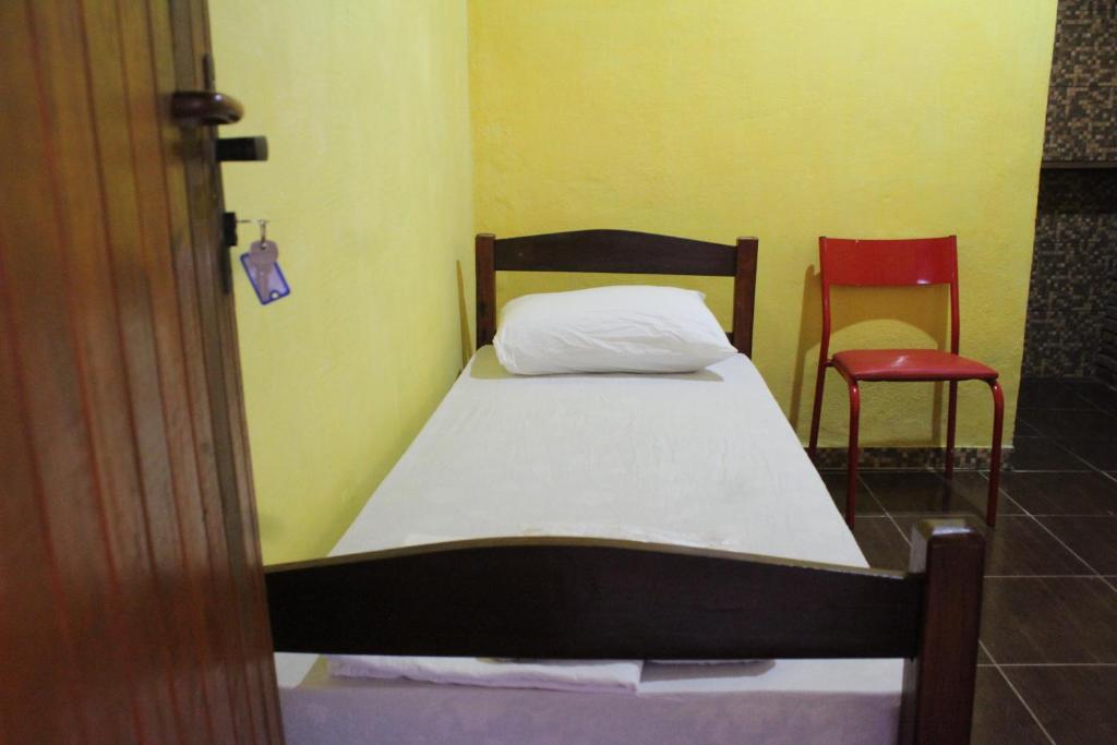 Postel nebo postele na pokoji v ubytování ROSÁRIO TEMPORADA Hostel