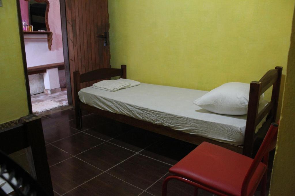 Postel nebo postele na pokoji v ubytování ROSÁRIO TEMPORADA Hostel