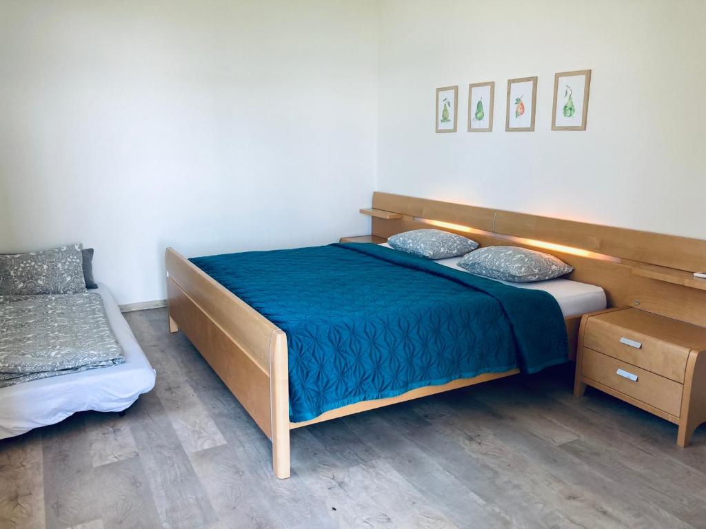 Postel nebo postele na pokoji v ubytování Édenkert Vendégházak