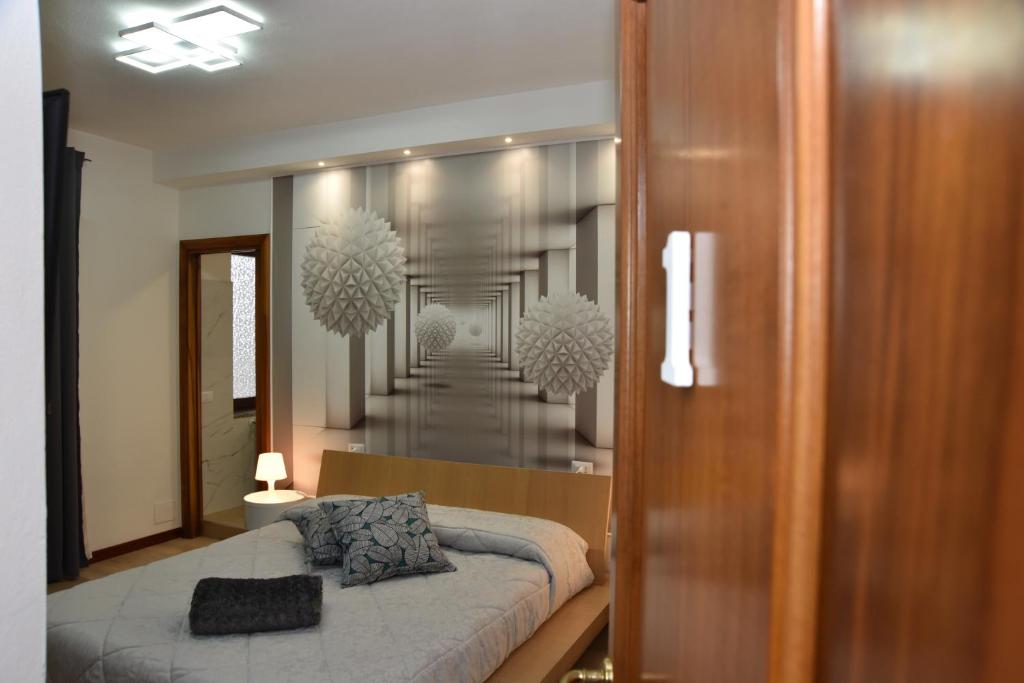 Postel nebo postele na pokoji v ubytování B&B LE DUE ISOLE
