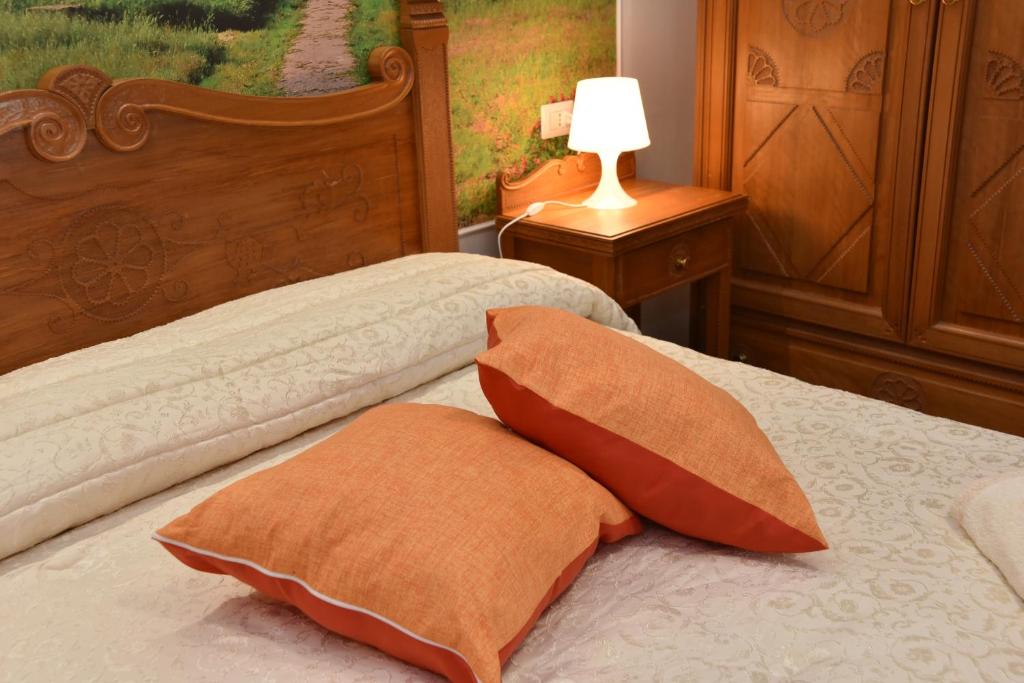 Postel nebo postele na pokoji v ubytování B&B LE DUE ISOLE