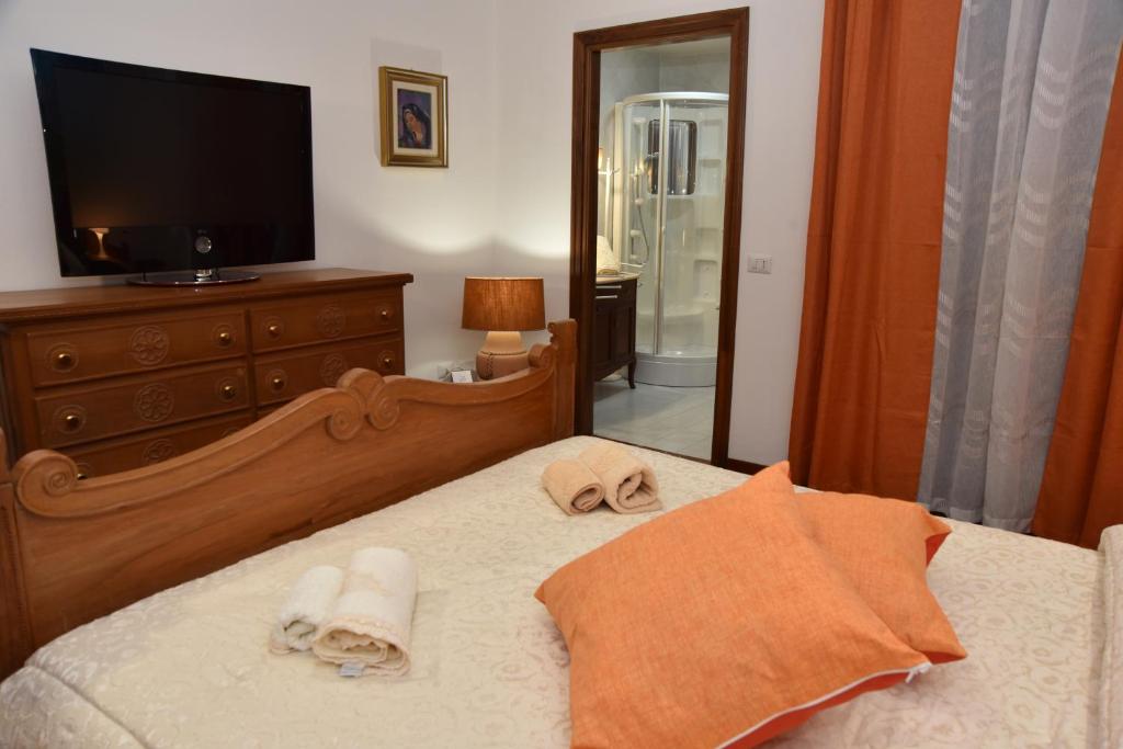 Postel nebo postele na pokoji v ubytování B&B LE DUE ISOLE
