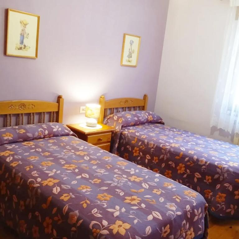 Postel nebo postele na pokoji v ubytování Casa Quini