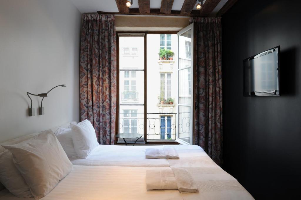 Posteľ alebo postele v izbe v ubytovaní Boutique Hotel de la Place des Vosges