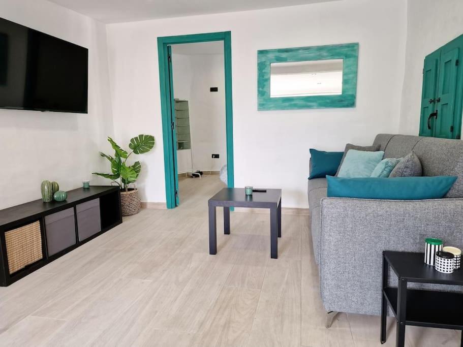 Posezení v ubytování APARTAMENTO CON TERRAZA Y BARBACOA