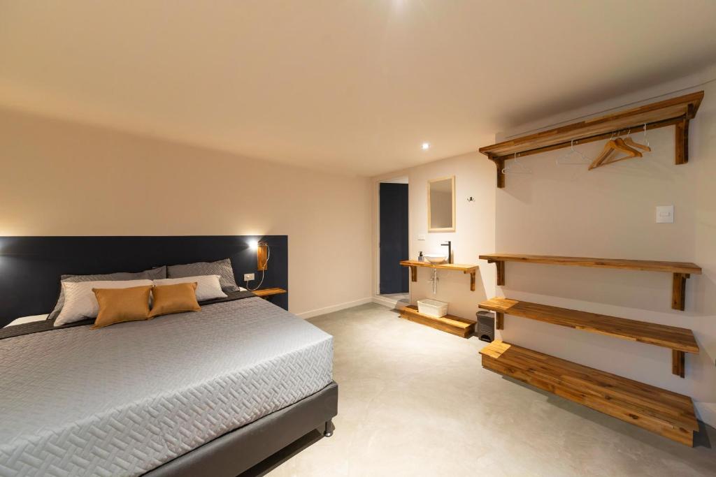 Postel nebo postele na pokoji v ubytování Casa Mosaiko Nutibara Laureles
