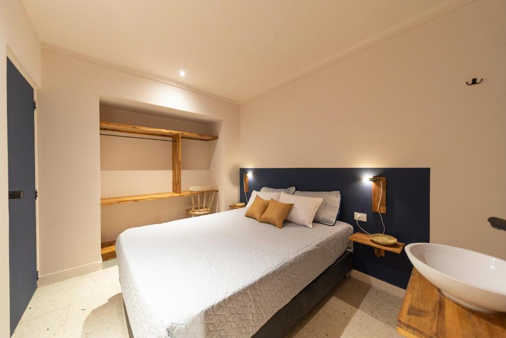 Postel nebo postele na pokoji v ubytování Casa Mosaiko Nutibara Laureles