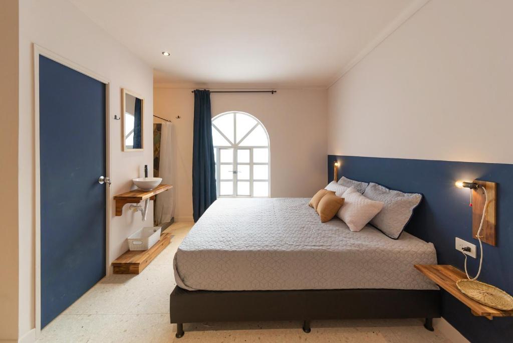 Postel nebo postele na pokoji v ubytování Casa Mosaiko Nutibara Laureles