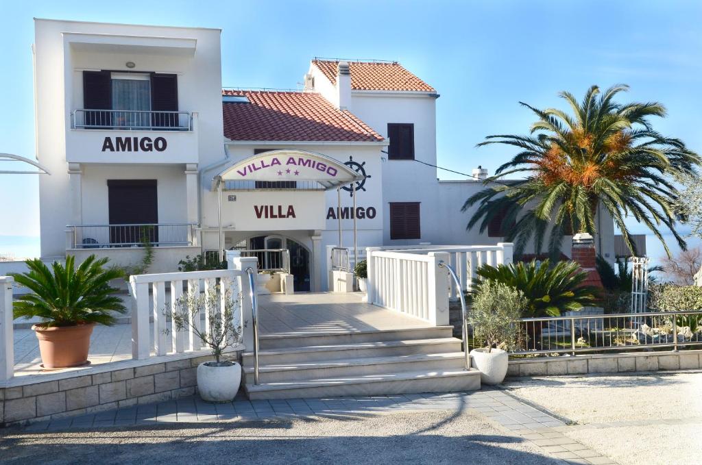 a building with a staircase in front of it at Villa Amigo in Podstrana