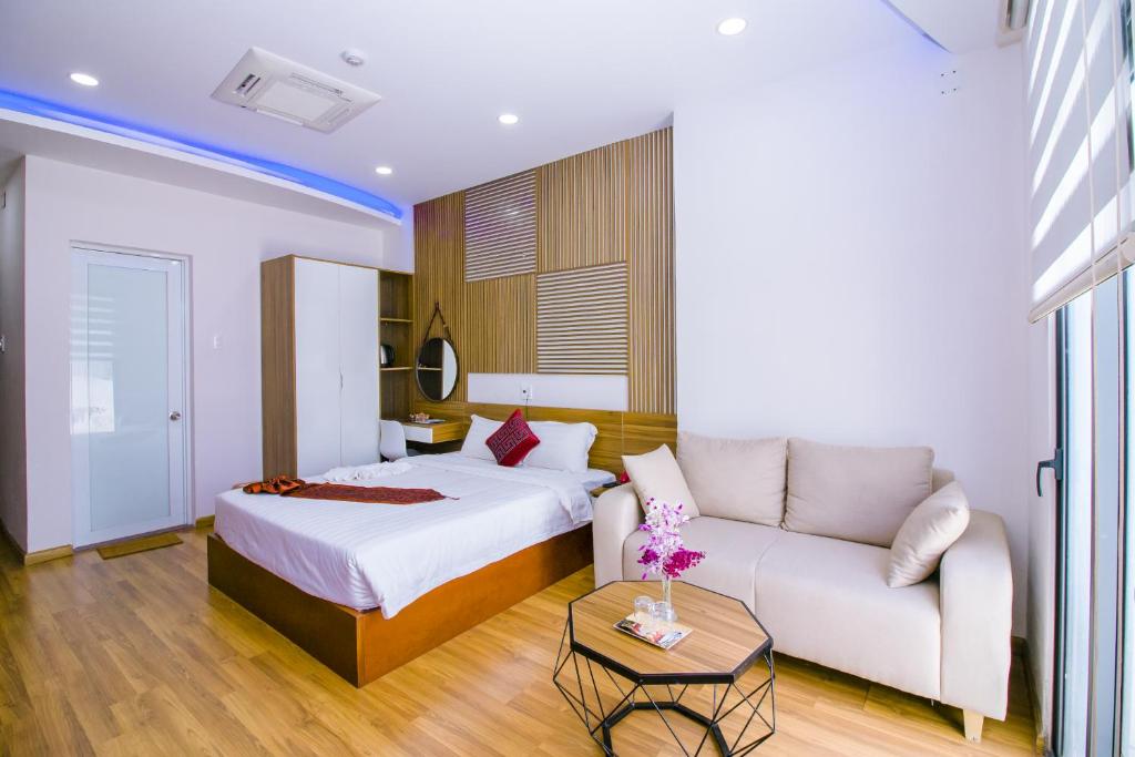 Giường trong phòng chung tại Anh Thảo Hotel Quy Nhơn