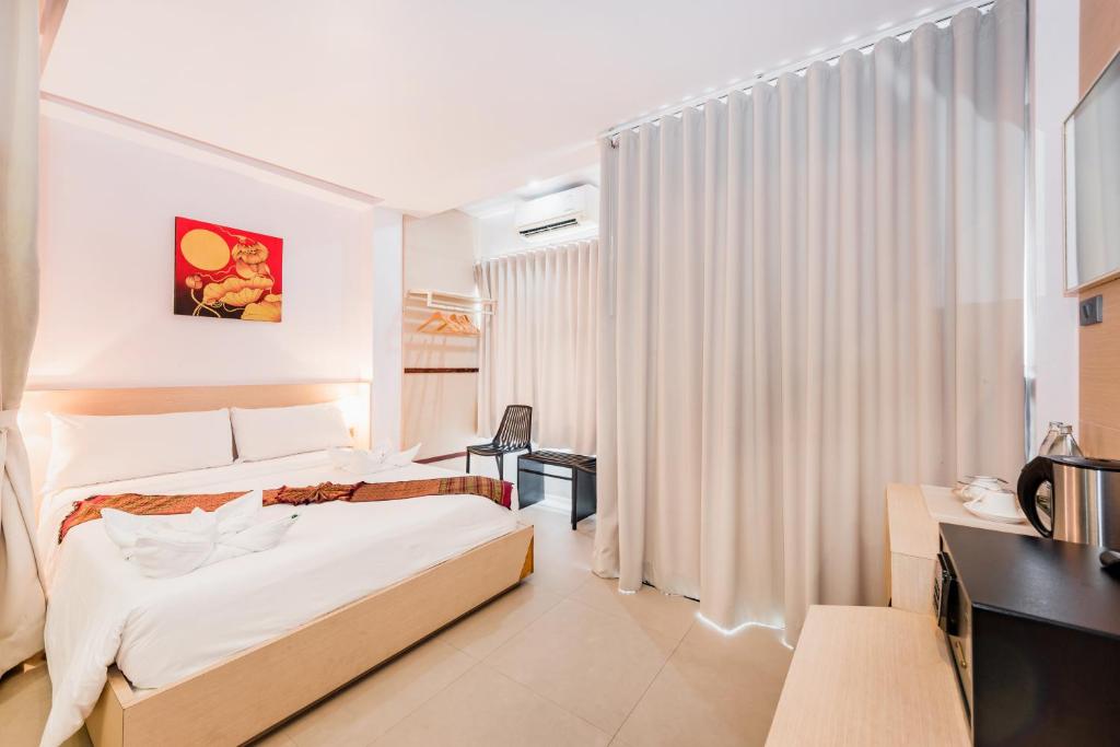 Postel nebo postele na pokoji v ubytování My Hotel Phuket