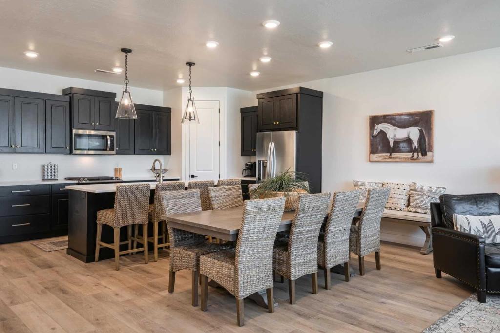 a kitchen and dining room with a table and chairs at Desert Azul townhouse in St. George