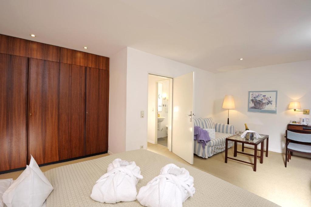 Postel nebo postele na pokoji v ubytování Hotel Baseler Hof