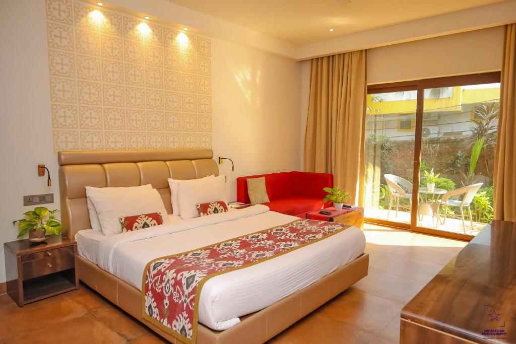 Кровать или кровати в номере The Ivy Anjuna